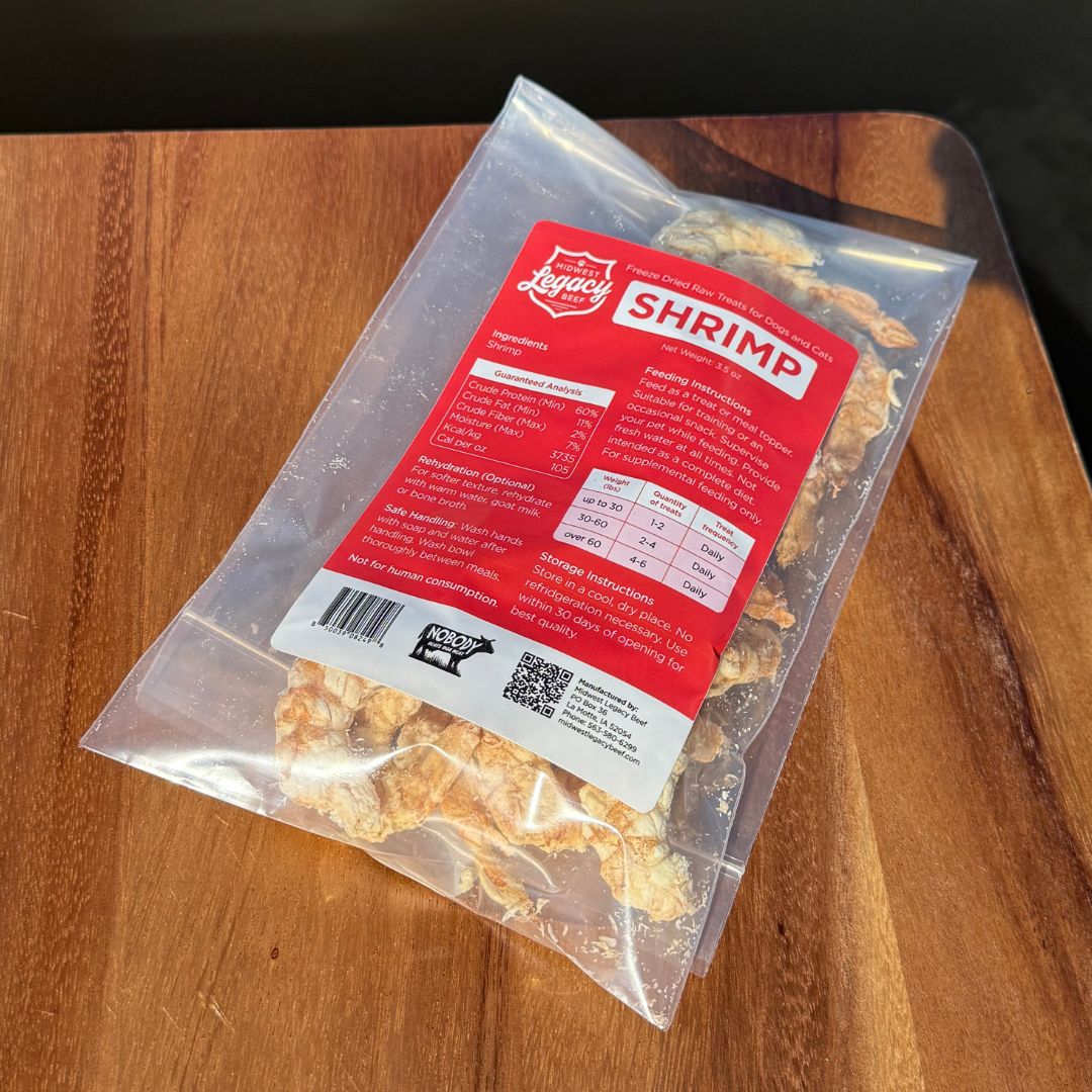Package of freeze dried shrimp with a red label on a wooden surface