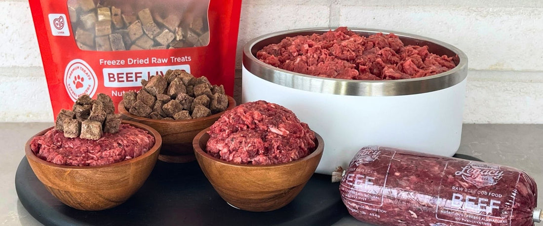 Midwest Legacy Beef raw and freeze-dried dog food displayed on black cutting board in kitchen.