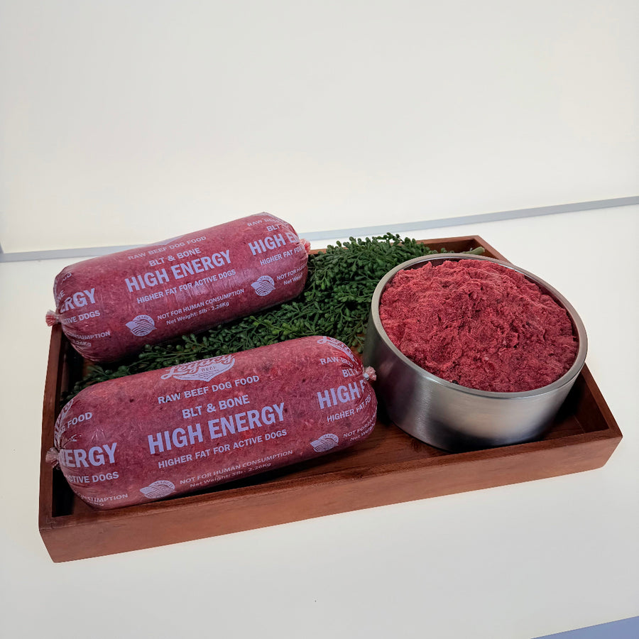 Legacy high-energy beef food rolls with red raw ground beef in a metal bowl